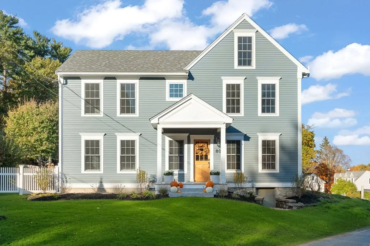 Front of an Amesbury MA home after a two-bedroom addition, matched siding and rooflines