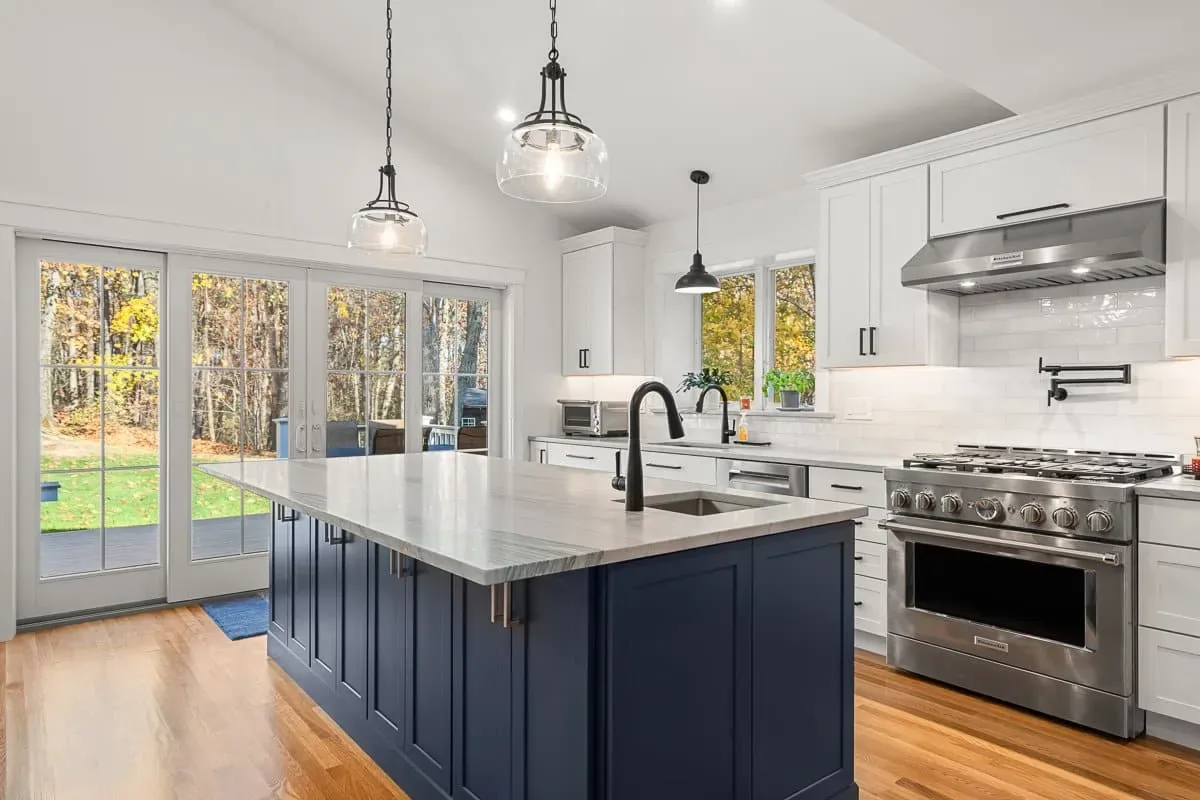 Kitchen addition with navy island and glass doors to the yard, Andover MA