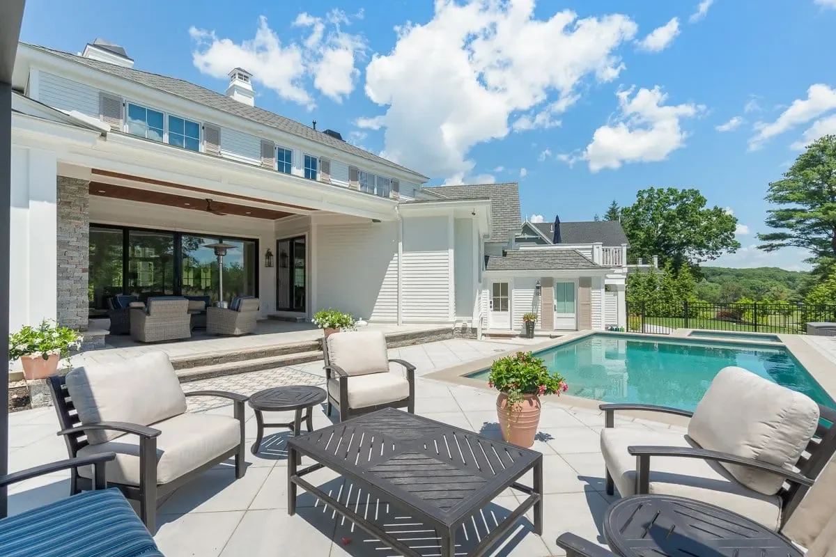 Rear patio and pool, Andover MA custom home by Norman Builders