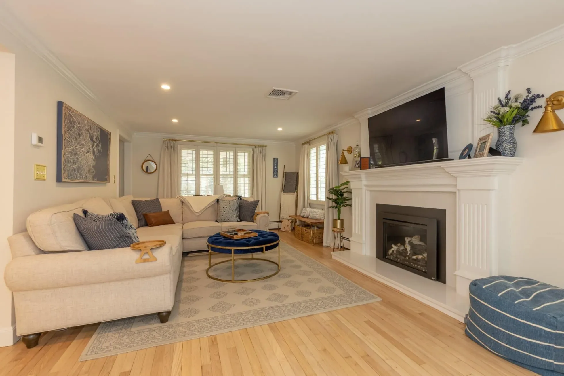 Family room with a custom fireplace surround and built-in details
