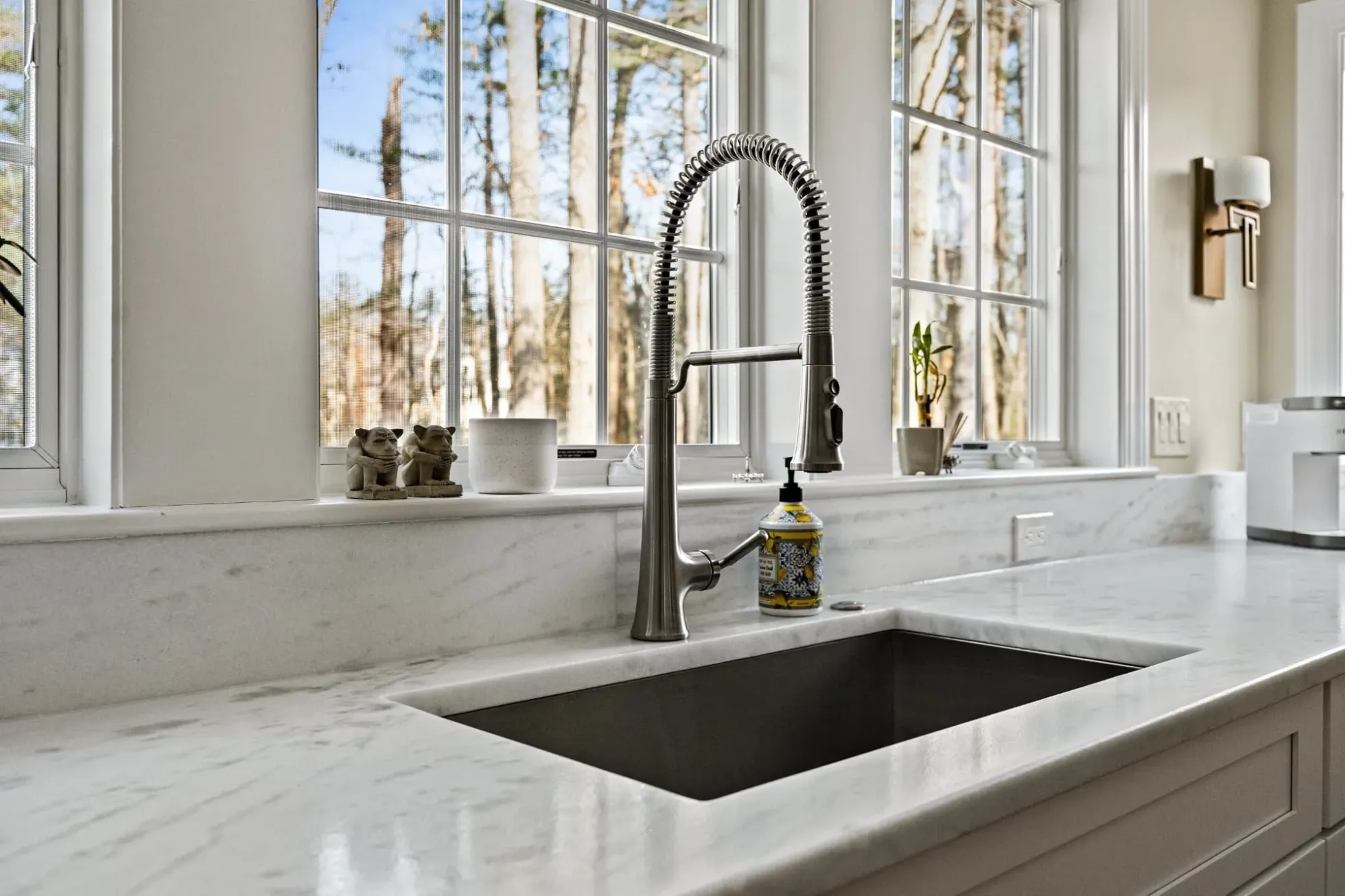 Undermount sink and pull-down faucet under oversized windows