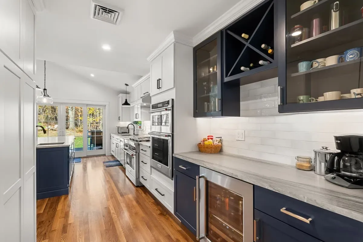 Beverage station with navy glass-front cabinets, wine storage and a wine refrigerator