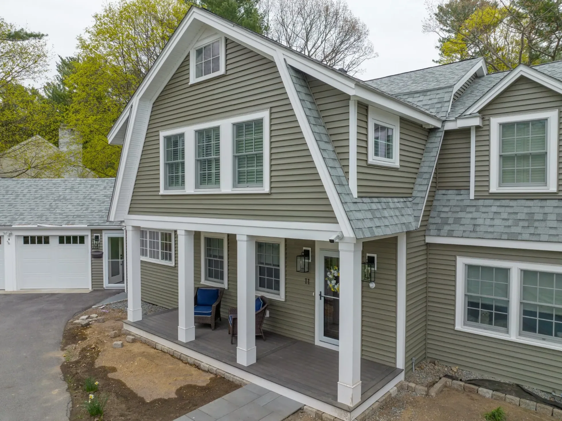 Covered porch with columns on the renovated gambrel home